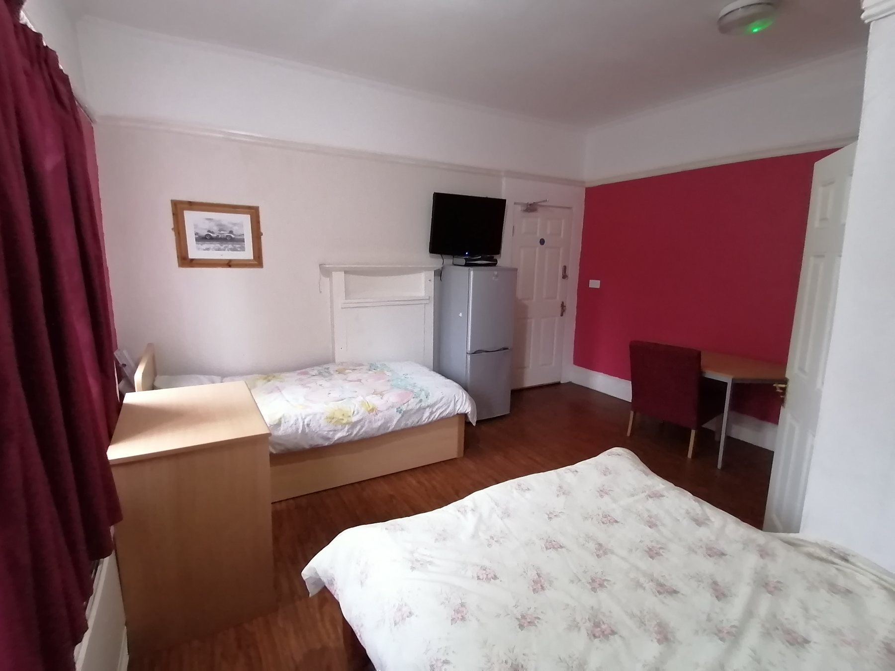 Example room photograph supplied by the hotel; confirm family room layout
